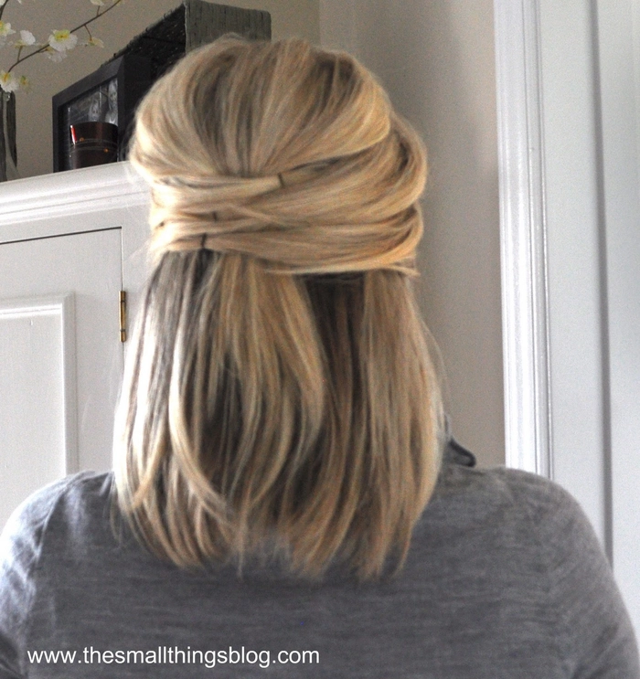 Elegant half-up hairstyle for a holiday theater outing with soft waves and delicate accessories