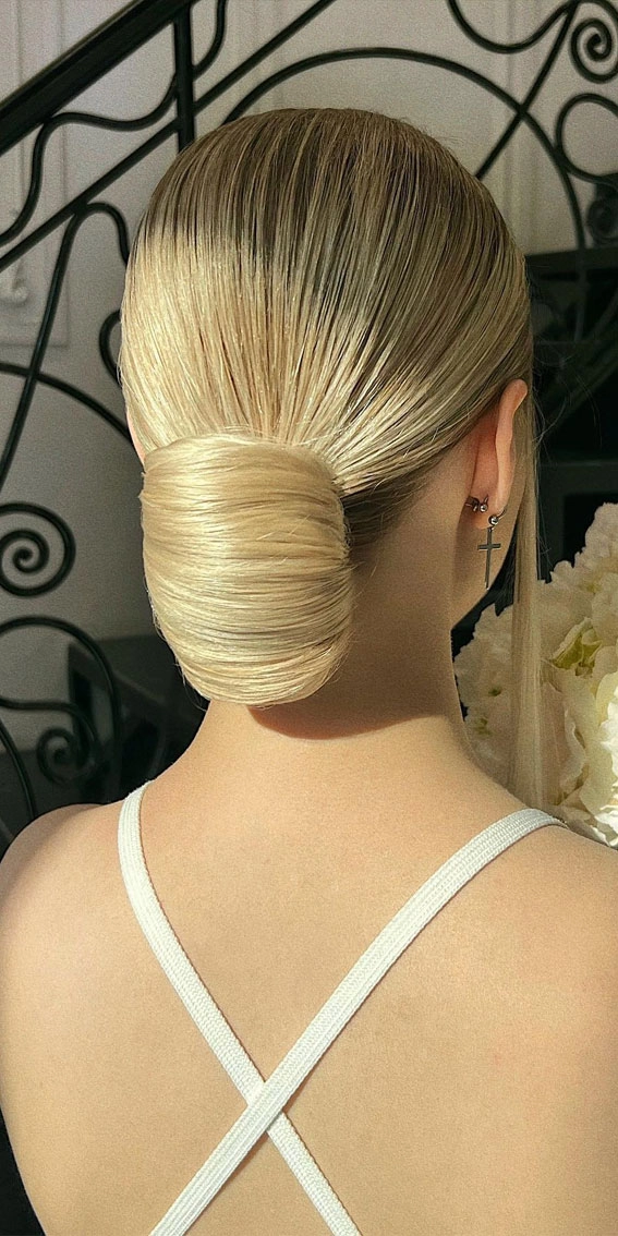 Stunning Holiday Hairstyle for Diwali Celebrations Elegant Diwali updo with floral accessories and gold pins