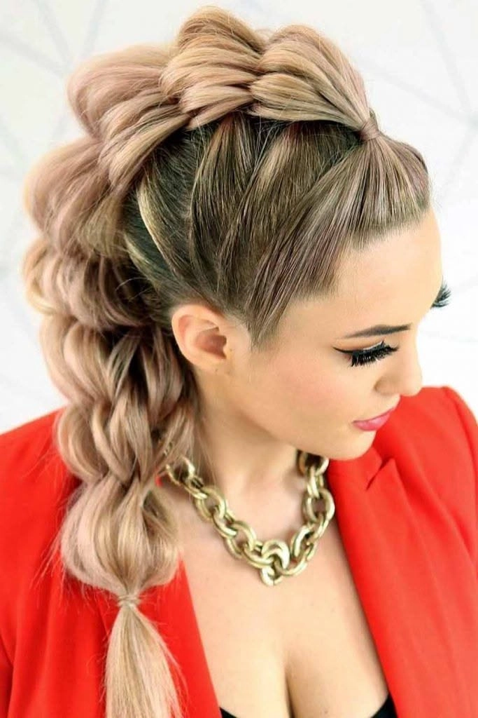 Faux hawk braids for an edgy holiday concert hairstyle A model with edgy faux hawk braids styled for a holiday concert