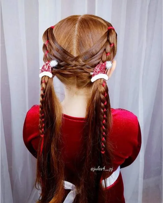 Little girl with festive braided pigtails decorated for holiday celebrations