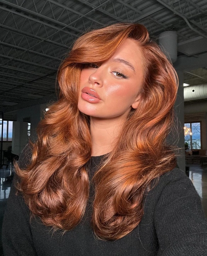 Voluminous blowout hairstyle for a festive cocktail party
