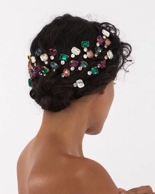 Festive Eid Hair Accessories with Gold and Pearl Details Elegant gold and pearl hair clips arranged on a satin cloth for Eid celebrations