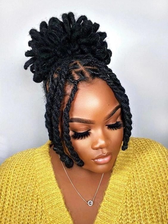 Festive winter loc styling with sparkling holiday accessories