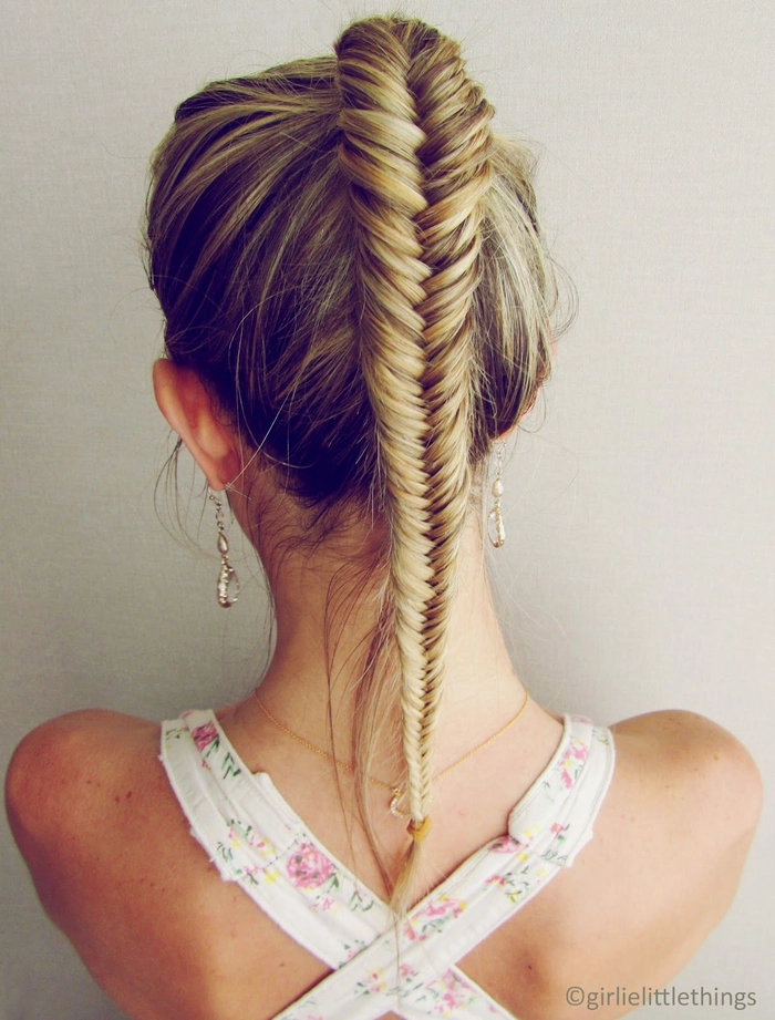 Casual fishtail braid hairstyle idea perfect for sunny holiday getaways A relaxed fishtail braid hairstyle for a casual holiday vacation on the beach