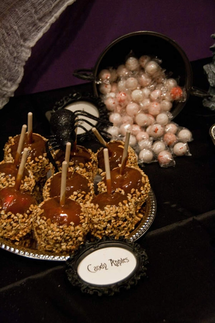 Gothic Victorian updo with dark accessories and intricate curls for Halloween events