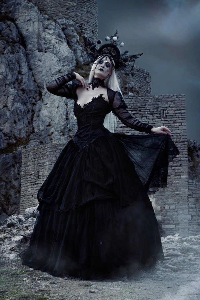 Elegant gothic Victorian updo with dark floral accessories for Halloween events