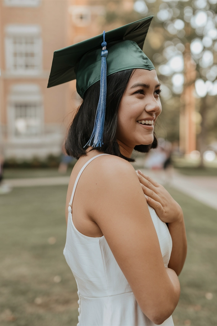 Elegant graduation updo hairstyle designed to fit comfortably under a mortarboard cap