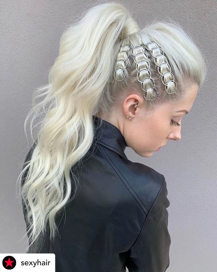 High ponytail inspiration for New Year's Eve clubbing with sleek hair and sparkly accessories