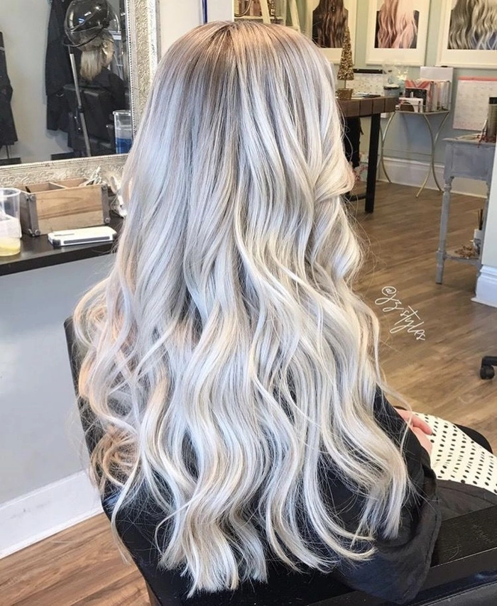 Icy blonde hair toning for a winter bride with a romantic updo and sparkling hair accessories