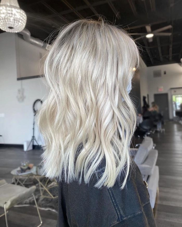 Winter bride with icy blonde hair toning for a cold-weather wedding