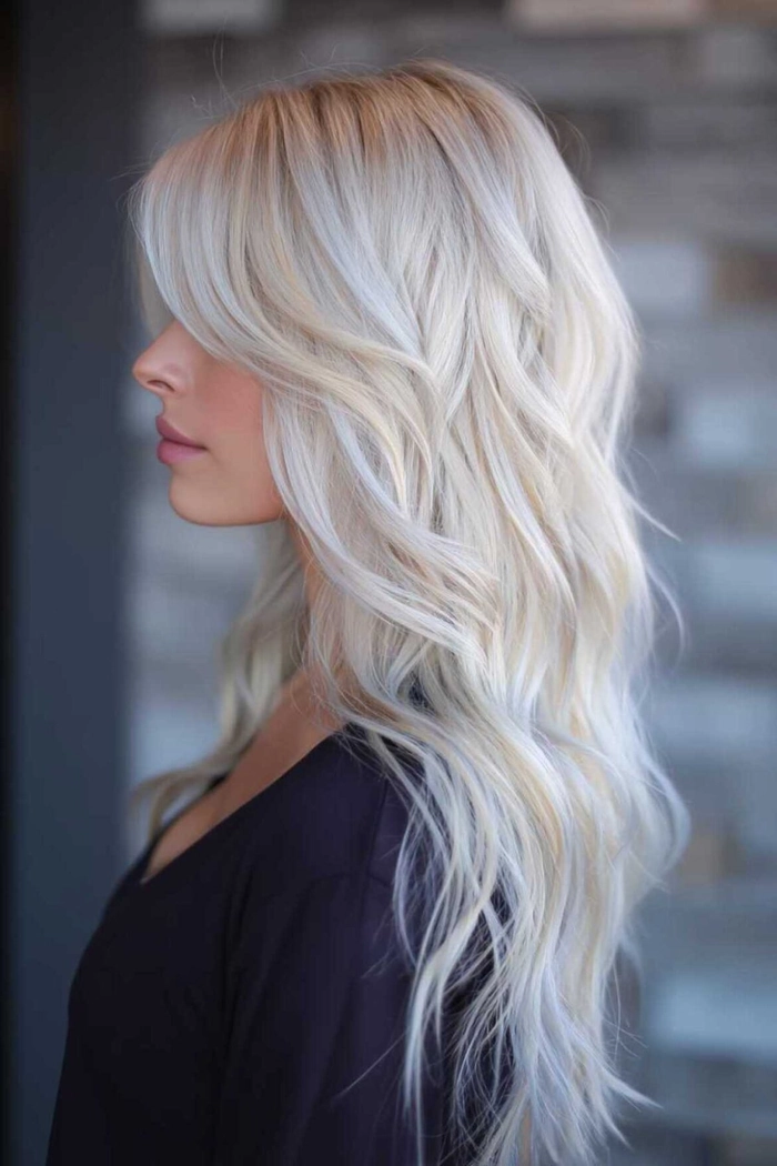 Winter bride with icy blonde hair toning and a festive holiday hairstyle