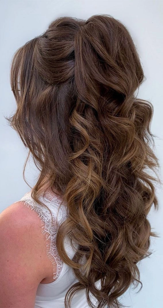 Elegant half up hairstyle perfect for a holiday theater outing