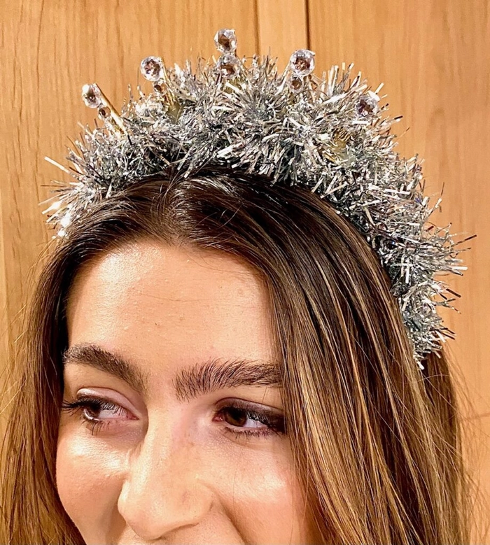 Sparkly hair clips and gemstone headbands on a stylish pixie cut for New Year's Eve