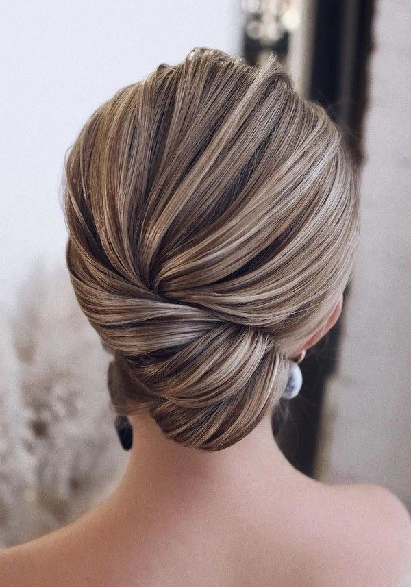 Elegant gray hair styled in a sophisticated updo for a holiday formal event