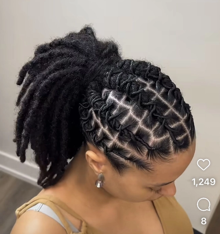 Locs styled elegantly for a festive winter holiday event with subtle sparkle accents