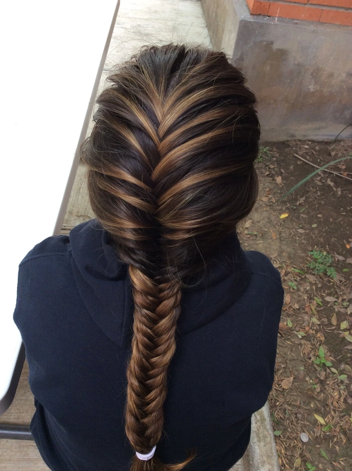 Fishtail braid hairstyle perfect for casual beach holiday getaways A relaxed fishtail braid styled for a sunny holiday vacation