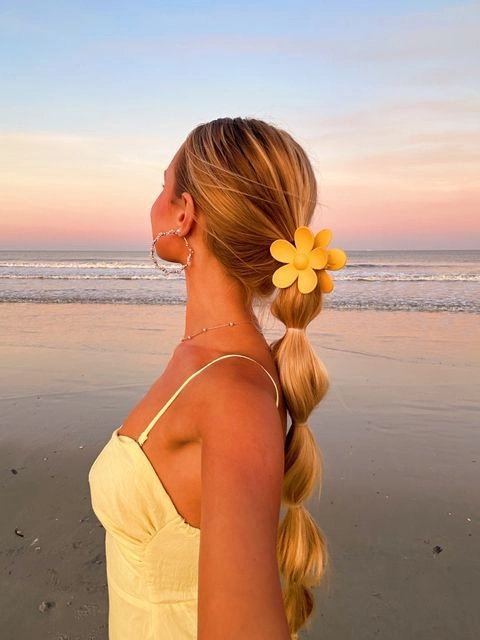 Labor Day end of summer hair transition trends for holiday hairstyles featuring a sleek ponytail with braided accent