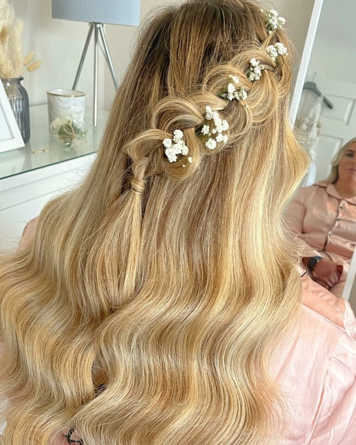 Four bridesmaids with matching braided hairstyles at a December wedding ceremony