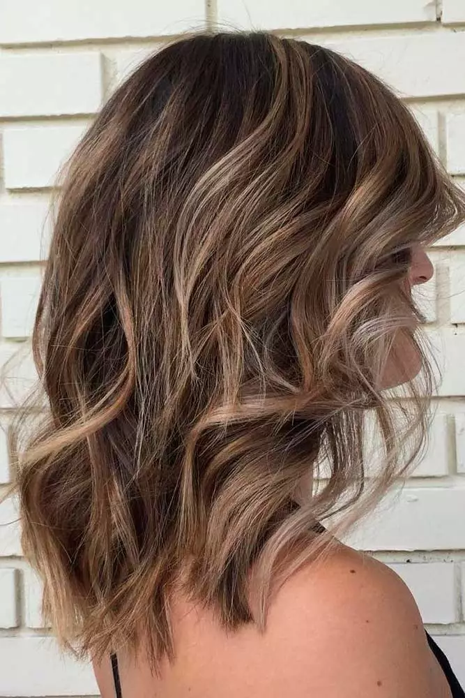 Medium length holiday waves styled on thick hair for a festive look