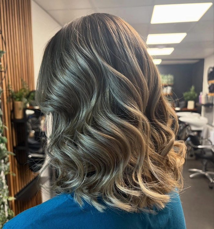 Medium length holiday waves for thick hair with soft curls and holiday shine