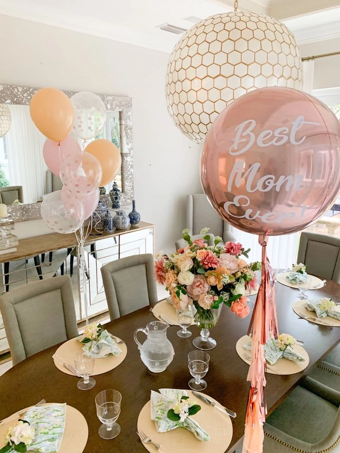 Elegant salon blowout hairstyle for Mother's Day with soft waves and volume