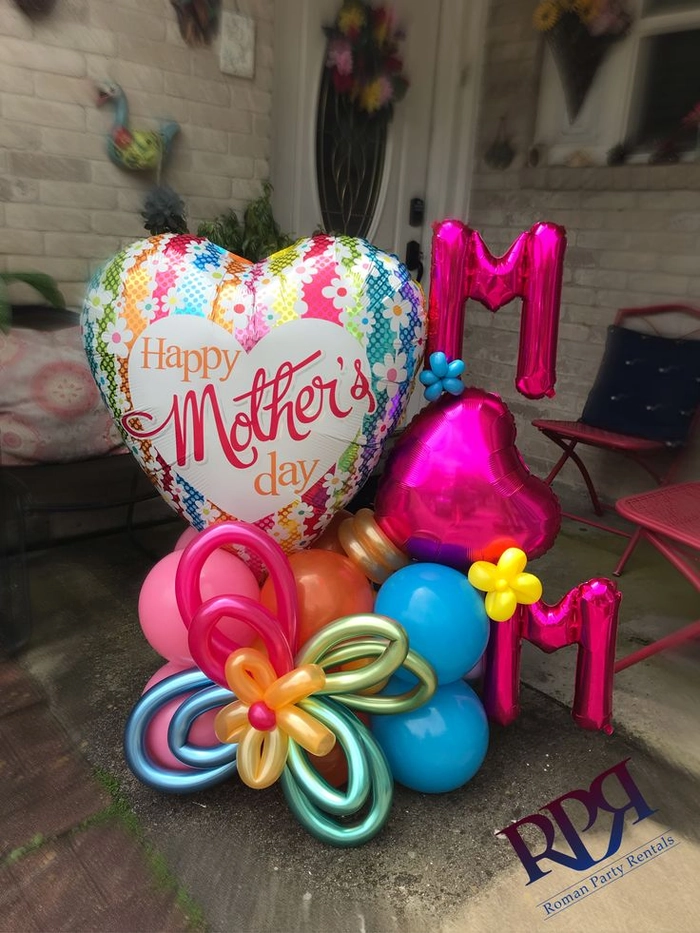 Sleek Mother's Day blowout with voluminous layers and a smooth, shiny finish