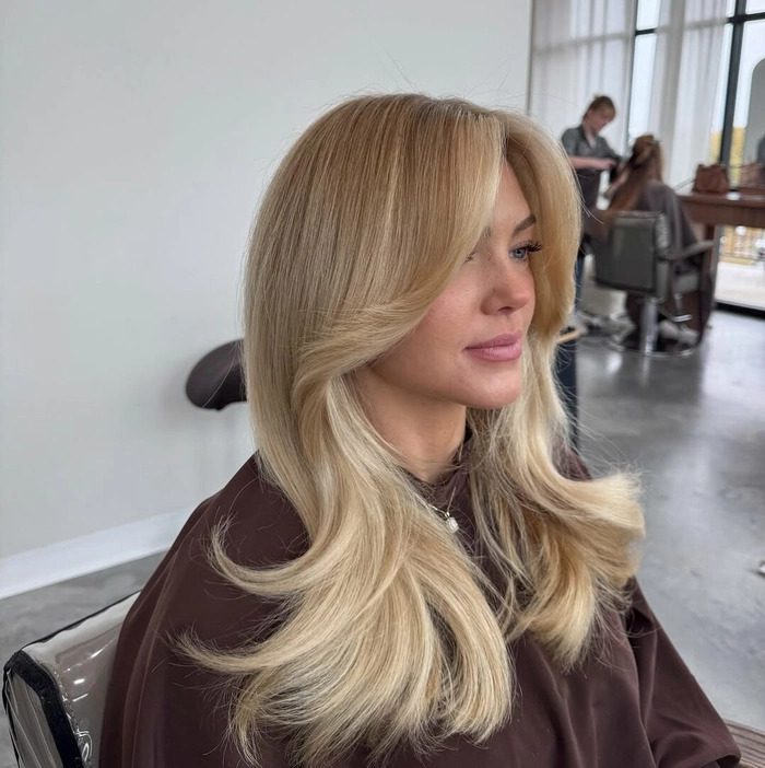An elegant salon blowout hairstyle perfect for a Mother's Day celebration
