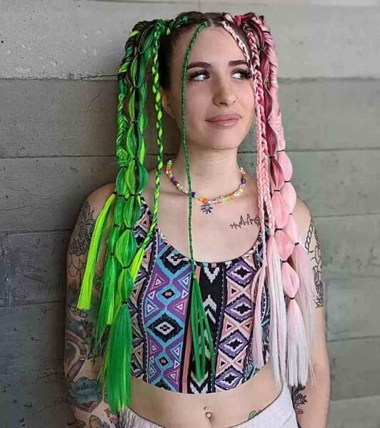 A woman with bright neon hair chalk streaks styled for a rave party crowd