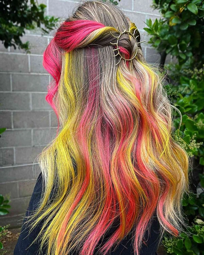 Woman with vibrant neon hair chalk colors styled for a rave party