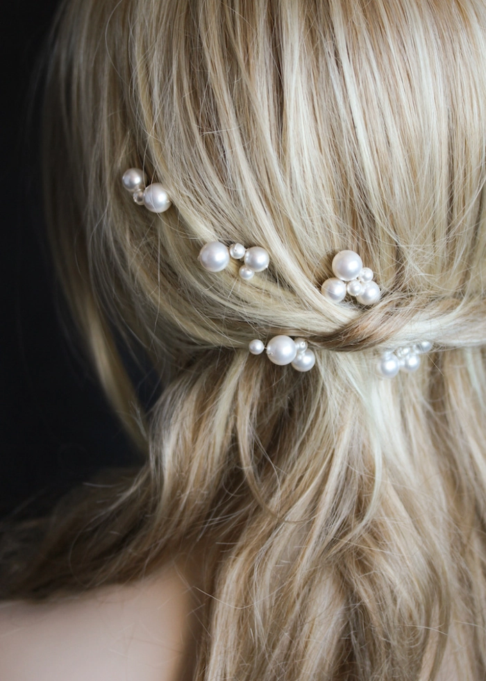 Styling pearl hair accessories for a festive holiday dinner party Pearl hair pins and clips adorning an elegant updo for Christmas dinner