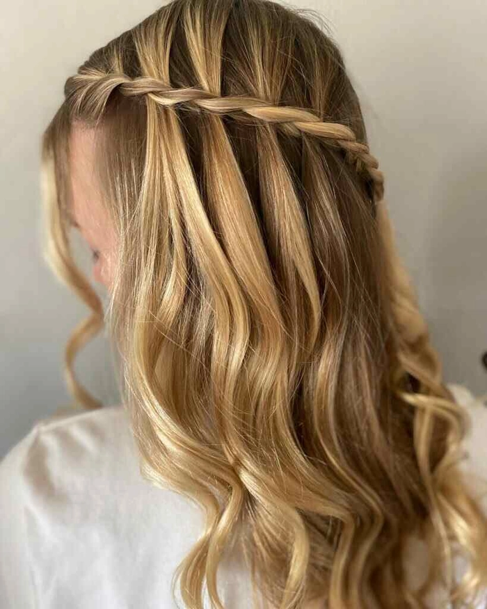 Elegant winter prom updo with sparkly hairpins for formal hairstyle inspiration