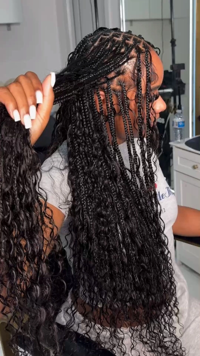 Relaxed boho braids styled for a Thanksgiving dinner with subtle floral accents