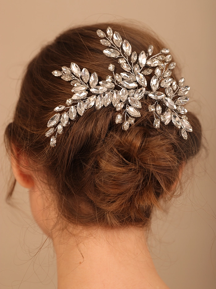 Sparkling holiday hairstyle accent with rhinestone comb Elegant rhinestone hair comb placement for a formal gala updo
