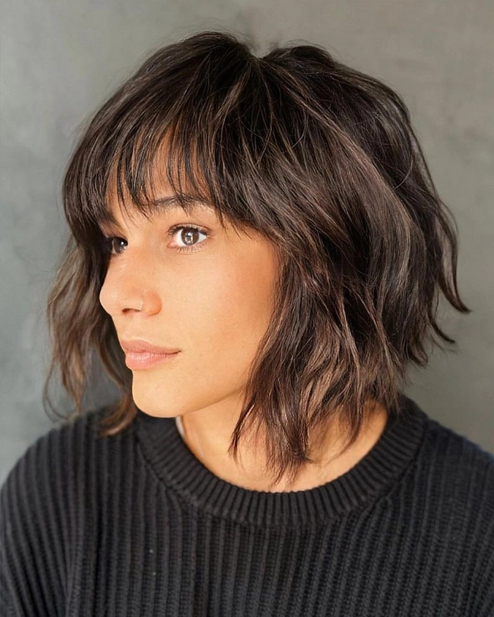 Festive short bob holiday styling for fine hair with subtle waves and shimmering accessories