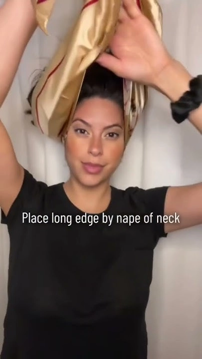 Step-by-step silk scarf wrapping technique for protecting hair during winter holidays