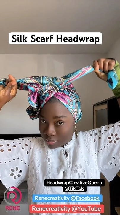 Woman in a festive outfit wrapping a silk scarf around her hair to protect it from winter cold
