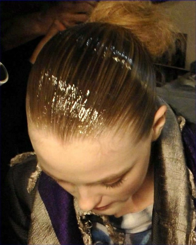 Sleek wet look hair with villain aesthetic for holiday hairstyle inspiration