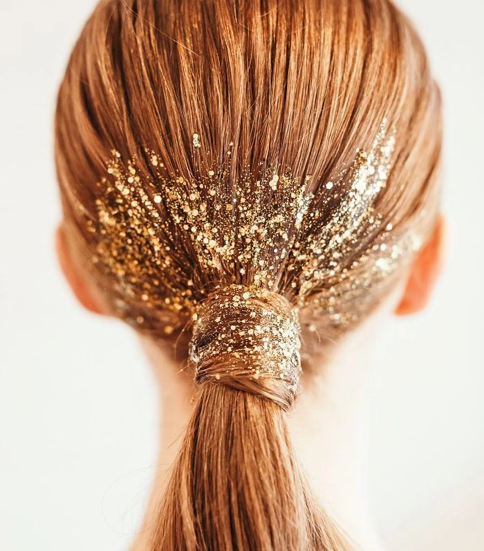 Sparkly hair clip placed elegantly in an updo for a New Year's Eve gala hairstyle