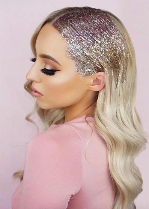Sparkly hair clip placement within an elegant updo for a New Year's Eve gala hairstyle