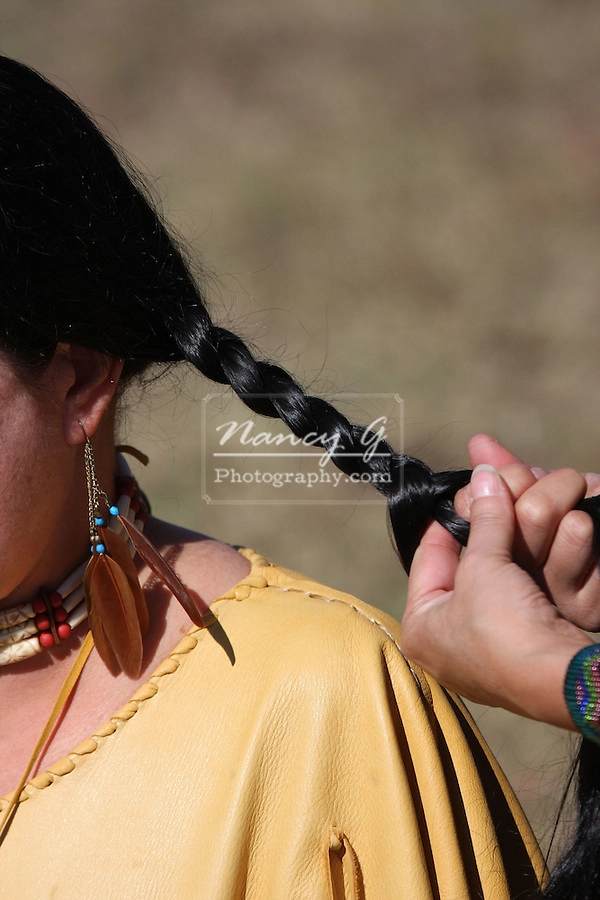 Women wearing intricate traditional braids during a cultural holiday festival