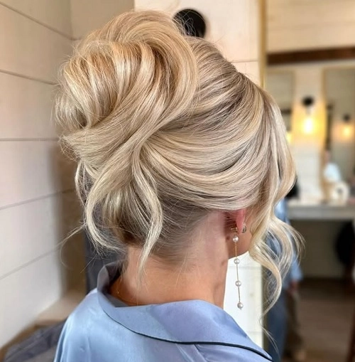 How to create a twisted halo updo for a cozy winter evening out Elegant twisted halo updo styled for a romantic winter date