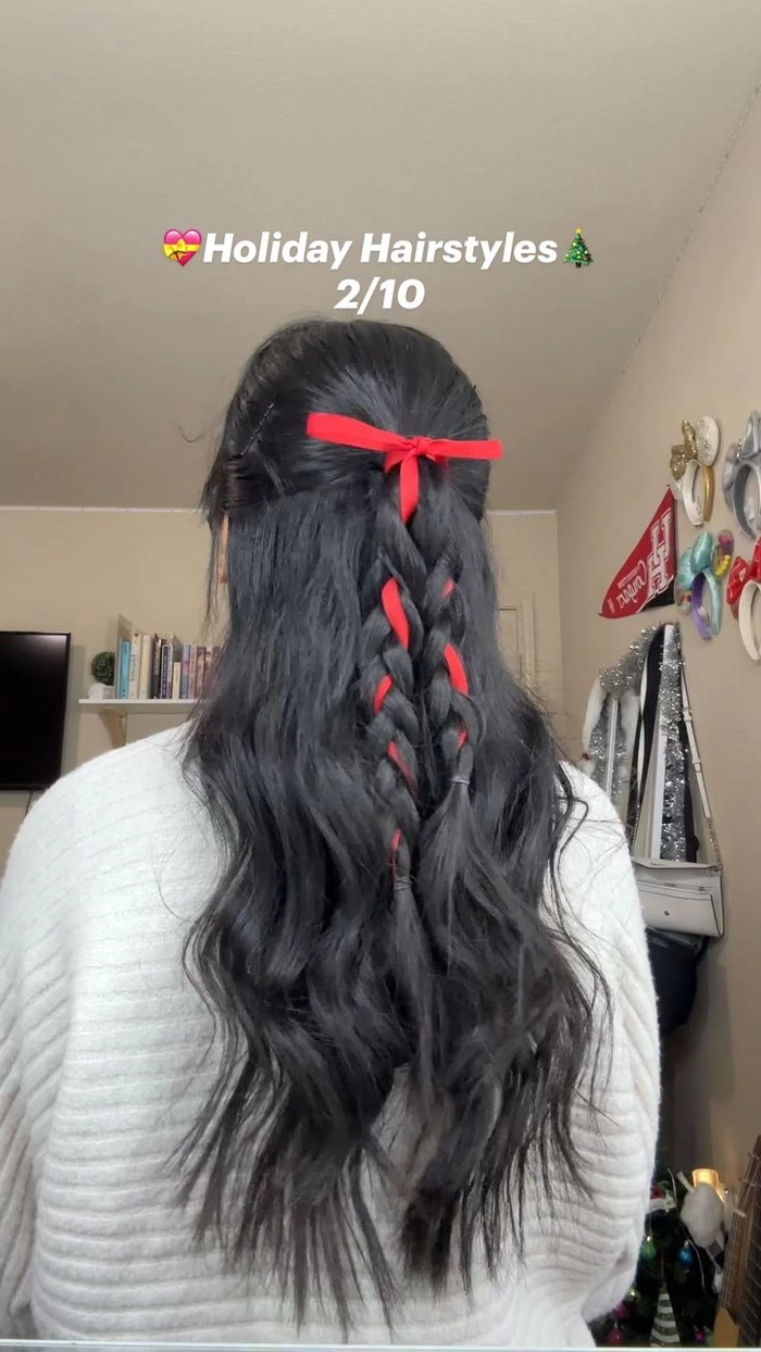 Elegant half up hairstyle accented with velvet ribbon for holiday celebrations Velvet ribbon half up holiday hairstyle with festive bow