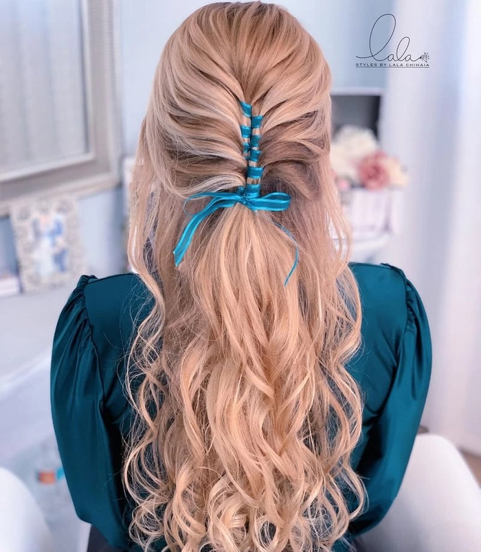 Velvet ribbon half up hairstyle for festive holiday occasions A woman with a half-up hairstyle tied with a velvet ribbon, perfect for holiday celebrations