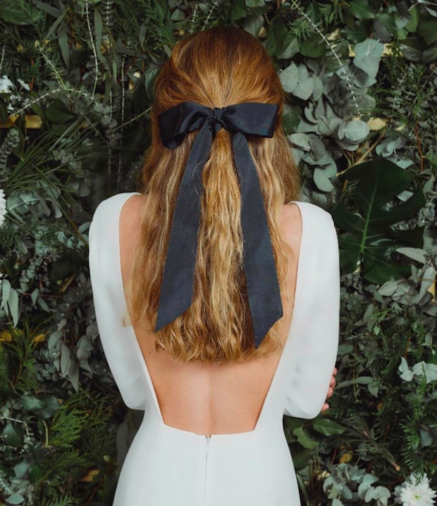 Elegant half up hairstyle tied with a velvet ribbon Velvet ribbon half up hairstyle for holiday celebrations