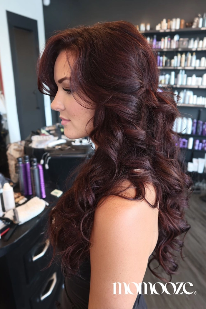 Warm tone hair color trends perfect for holiday hairstyles Model showcasing warm tone hair color for holiday season with festive hairstyle