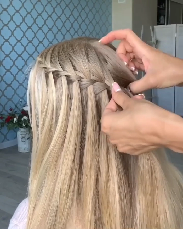 Soft waterfall braid styled for a daytime holiday celebration
