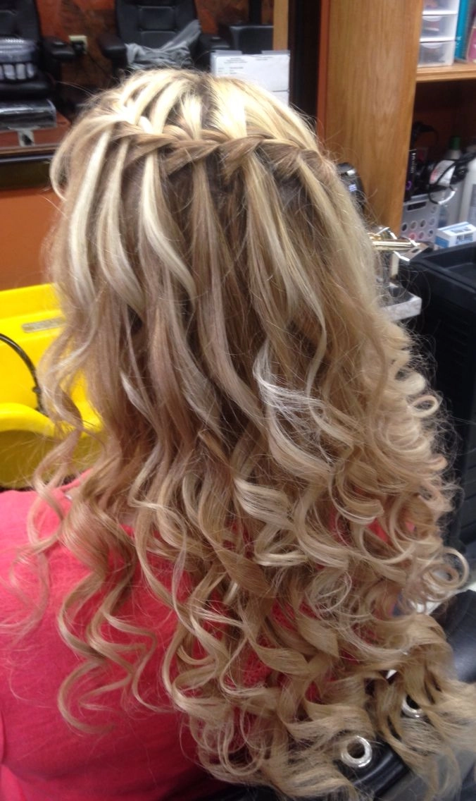 Waterfall braid styling for daytime holiday events with soft waves and subtle festive accents