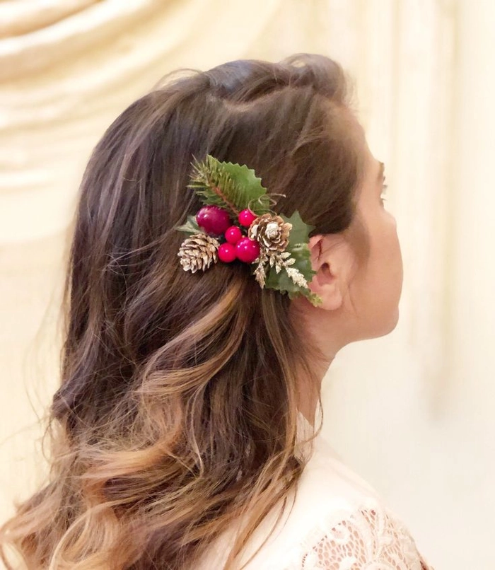 Winter bridesmaid updo adorned with festive floral pins