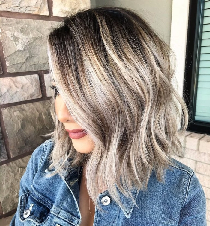 Woman with textured lob hairstyle smiling at an autumn birthday party