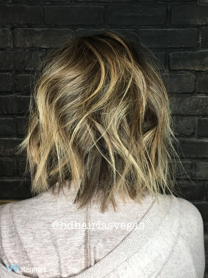 Woman with a textured lob hairstyle celebrating an autumn birthday party